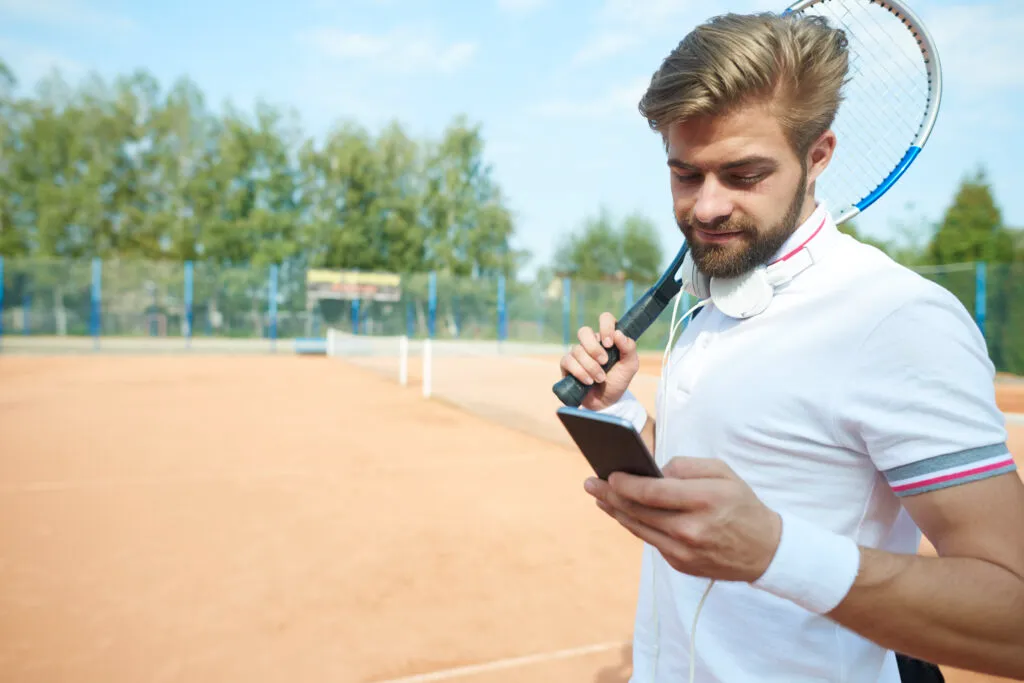 Tennis player on phone